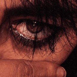 Jade Bittersweet — portrait, hand partially covering face